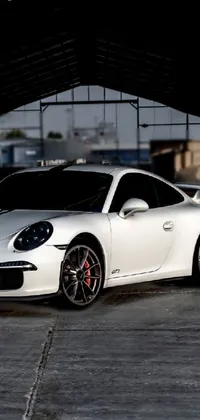 This stunning live wallpaper showcases a white sports car parked inside a building, and is sure to elevate your phone's look