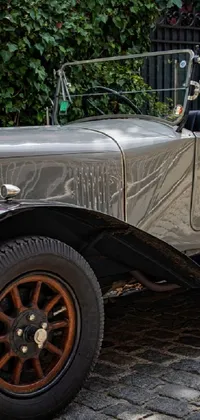Experience the nostalgia of a bygone era with this stunning vintage car live wallpaper