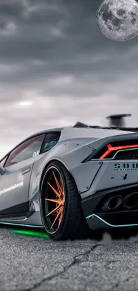 Get revved up with this stunning live wallpaper for your phone! Featuring a white and grey sports car on the open road, this Tumblr-esque design is ultra-detailed, with intricate features such as brilliantly-colored lights and a realistically-blurred background of wilderness beyond the asphalt