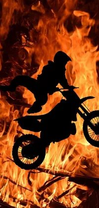 Looking for an intense, action-packed live wallpaper for your phone? Check out our latest design featuring a dirt bike flying through flaming hellish terrain