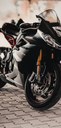 Looking for a stunningly realistic <a href="/">phone live wallpaper</a>? Check out this image of two motorcycles parked side by side, featuring a huge black and gold Ducati Panigrale