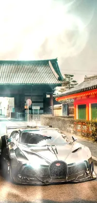 This live wallpaper depicts a stylish Bugatti car parked by a serene Japanese temple set against a breathtaking natural backdrop