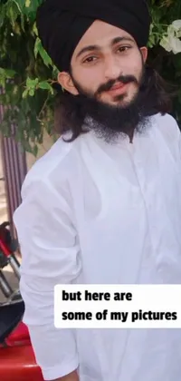 This unique phone live wallpaper depicts a bearded man of Middle Eastern or Indian descent, wearing a colorful turban and traditional thobe dress