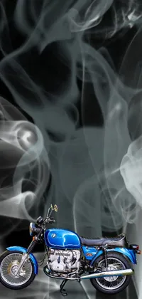 This live wallpaper showcases a blue motorcycle emitting smoke on a black background