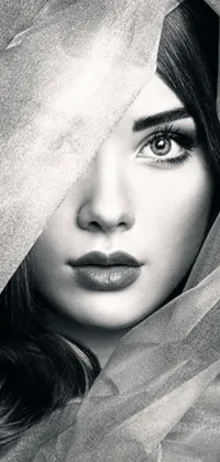 This stunning phone live wallpaper features a stunning black and white digital art portrait of a mystery woman