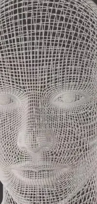 This phone live wallpaper features a stunning wire sculpture of a man's face in intricate shades of white and grey