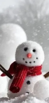 Transform your phone into a winter wonderland with this live wallpaper featuring a charming snowman in the snowy landscape