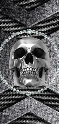 This live wallpaper features a digital rendering of a skull in extreme close-up, set against a metallic surface