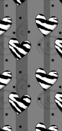 This phone live wallpaper features an eye-catching black and white pattern of hearts and stars set against a gray backdrop