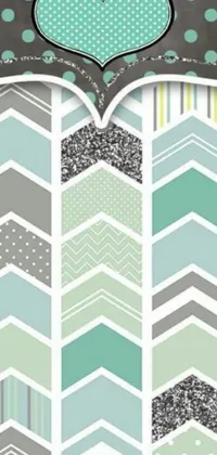 This phone live wallpaper boasts chevron and polka dot patterns in a seafoam color palette that glimmers with silver layers