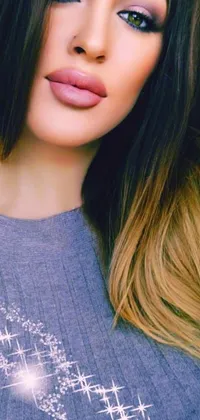 This phone live wallpaper showcases a closeup of a beautiful woman with long, brown straight hair and ombre color effect