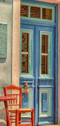This stunning phone live wallpaper displays a wooden chair in front of a blue door with a photorealistic painting