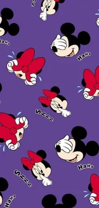 This live wallpaper features a playful Mickey and Minnie Mouse pattern on a purple background