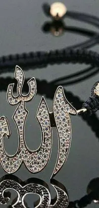 This phone live wallpaper depicts a close up of an arabesque-designed bracelet on a table