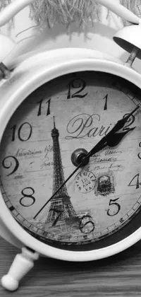 This black and white clock live wallpaper captures the striking beauty of the Eiffel Tower in the background of the photo