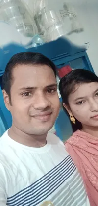 This phone live wallpaper showcases a romantic couple posing for a picture against an Assamese aesthetic backdrop