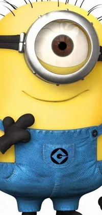 This lively and colorful phone background is a close-up of a yellow minion dressed in its signature denim overalls