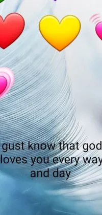 Introducing a stunning phone live wallpaper featuring a feather with heart graphics and the uplifting message "just know that god loves you every way and day"