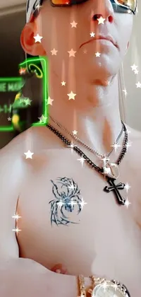 This phone live wallpaper showcases a digital art of a tattooed man with a futuristic cyber necklace