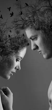 This captivating phone live wallpaper features a black and white photo of a man and woman gazing into each other's eyes with a sense of romanticism