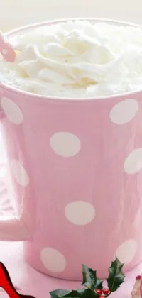 This phone live wallpaper boasts a soothing close-up of a coffee cup topped with whipped cream, served against a pastel backdrop peppered with polka dots