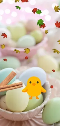 This cute phone live wallpaper features a bowl filled with hatchling chicks coming out of eggs on a table with bokeh effect in the background
