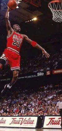 This lively phone live wallpaper depicts a basketball superstar leaping through the air with ball in hand, aiming for the hoop