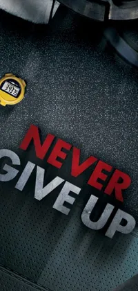 This phone live wallpaper showcases a movie reel with the phrase "never give up" designed in bold letters