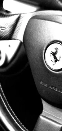 This live wallpaper features a black and white photo of a steering wheel atop a prancing horse, with custom imagery options like Facebook photo, scorpion, Tesla car, and more