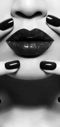 Liven up your phone screen with a stunning black and white live wallpaper featuring a striking image of a woman with black nails and intense eyes