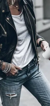 This live wallpaper features an edgy woman wearing a leather jacket and ripped jeans holding two coffee cups