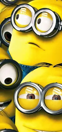Get ready for some mischievous fun with our Minion Group Live Wallpaper! This phone wallpaper showcases a group of yellow minions standing together, with playfully bright yellow eyes