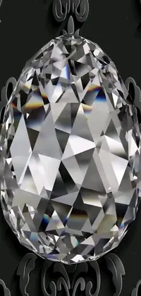 This phone live wallpaper showcases a stunning diamond set against a black background with intricate patterns, as well as a version with a white diamond and black background
