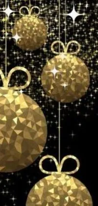 This live wallpaper showcases sparkling golden Christmas balls hanging from strings on a black background
