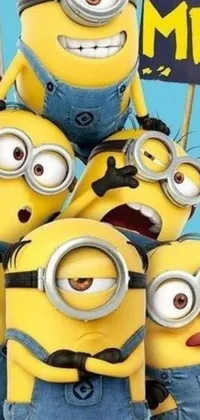 This phone live wallpaper portrays a cartoon group of minions in a playful and colorful style, standing together in a piled around formation