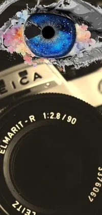 This phone live wallpaper features a stunning close up of a vintage Leica III camera with a bright blue eye peeking through the lens