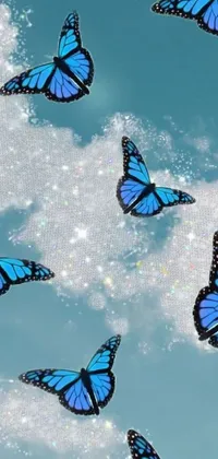 This stunning phone live wallpaper features a mesmerizing digital rendering of blue butterflies in flight against a serene sky, with sparkling crystals and fluffy cotton clouds in the background