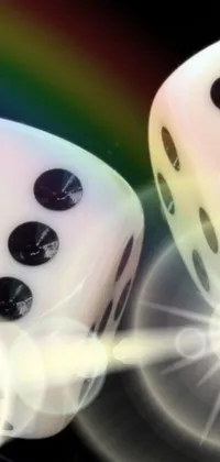 This live phone wallpaper features two white and black-spotted dice positioned together on a table