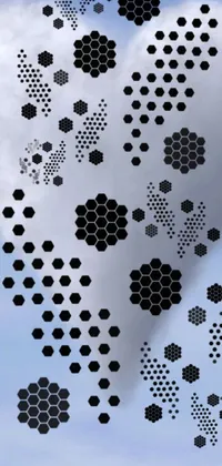 Looking for a unique live wallpaper for your phone? Check out this abstract concept art design featuring a cloud of black and white hexagons swirling in a tornado alongside falling money