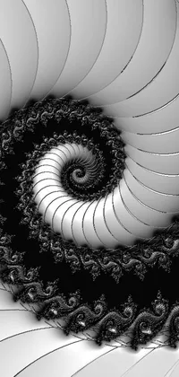 The phone live wallpaper features a spiral design in black and white, inspired by fractal geometry, with intricate worms coiled around it within a forest made entirely of gradients