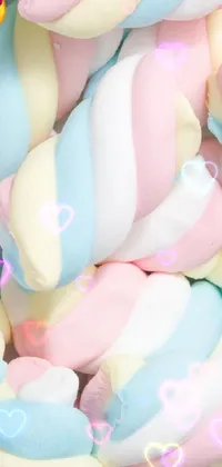This live wallpaper features a pile of soft and fluffy marshmallows in a pastel color palette