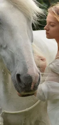 This live wallpaper depicts a woman and a white horse in a renaissance-inspired scene