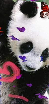 Bring life to your phone with this adorable live wallpaper featuring a playful panda bear climbing up a tree