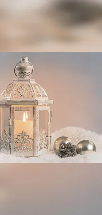 This phone live wallpaper boasts a stunning baroque-style candle resting elegantly in the snow