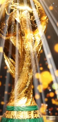 This stunning live wallpaper showcases a golden trophy set on a table, with a hologram of the World Cup hovering above it