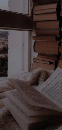 Looking for a cozy and introspective phone live wallpaper? Look no further than this warm and inviting scene featuring a book on a bed next to a window