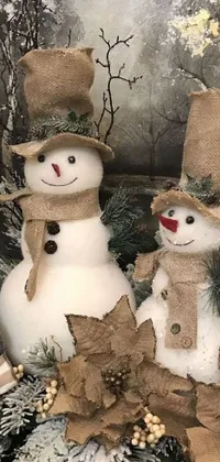 Add some winter charm to your phone homescreen with this delightful live wallpaper featuring two cuddly snowmen