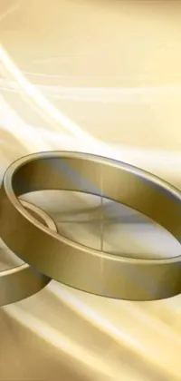 Get mesmerized by this stunning phone live wallpaper featuring two wedding rings
