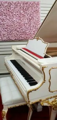 This phone live wallpaper displays a grand white piano placed on a red carpeted floor in a room with a wall painting