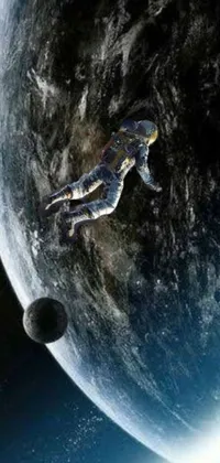 This phone live wallpaper portrays an astronaut floating in space with a planet in the background